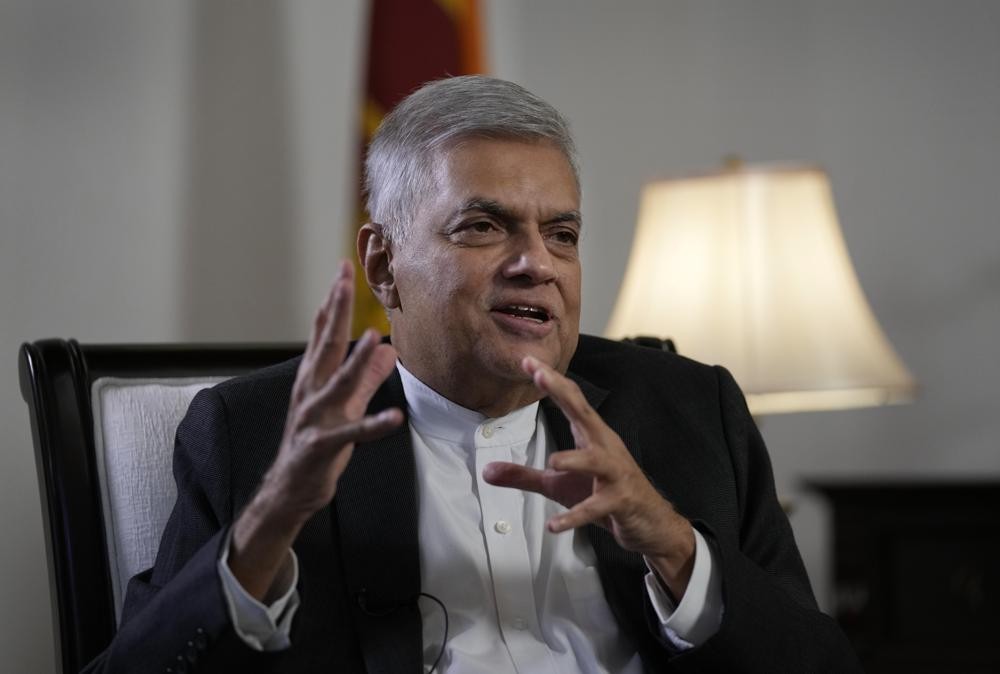 Sri Lanka's new prime minister Ranil Wickremesinghe gestures during an interview with The Associated Press in Colombo, Sri Lanka, Saturday, June 11, 2022. Sri Lanka may be compelled to buy more oil from Russia amid the island nation's unprecedented economic crisis, even as Western nations have largely boycotted Moscow as punishment for its invasion of Ukraine, the newly appointed prime minister said. (AP Photo/Eranga Jayawardena)